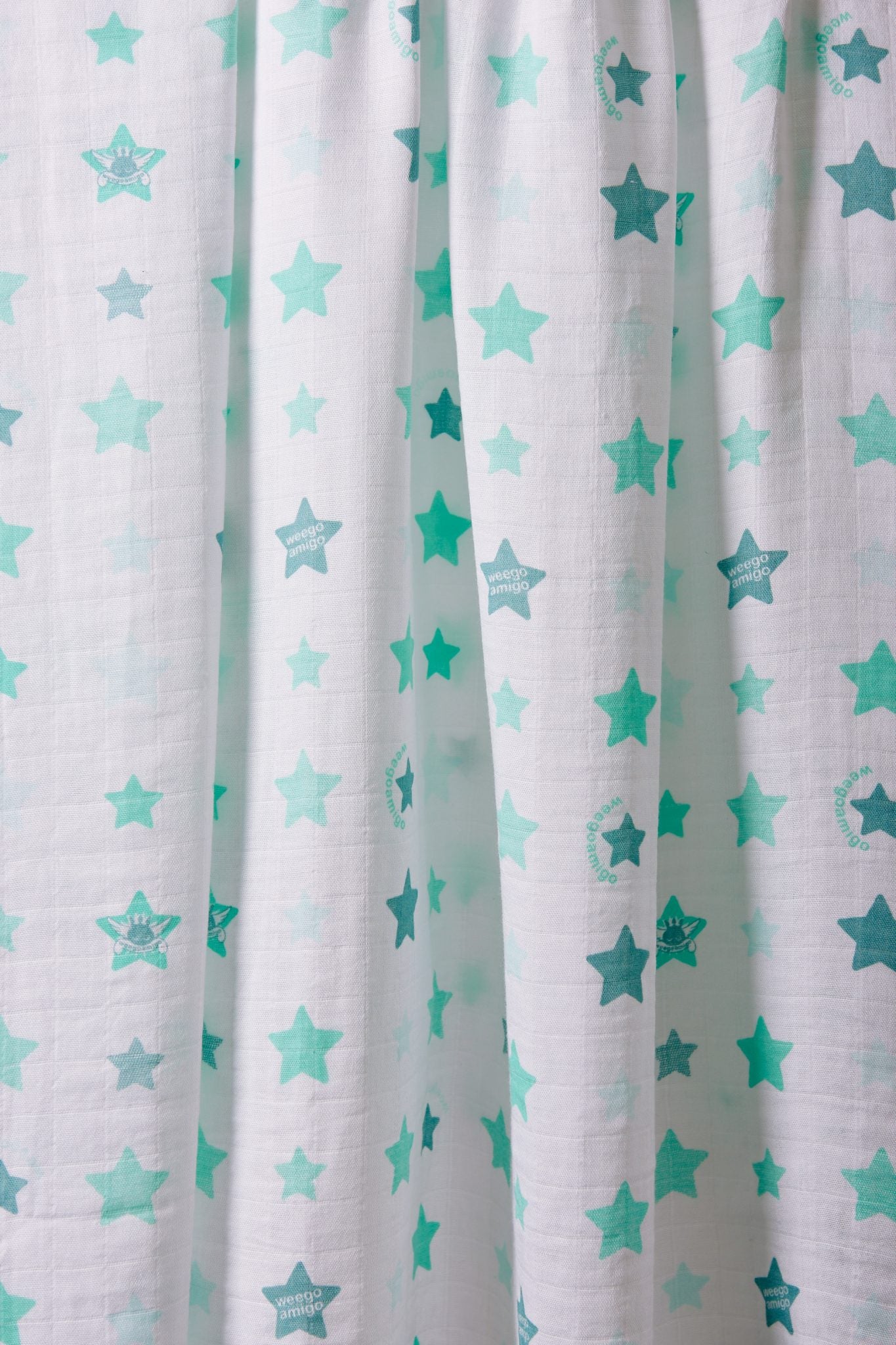 Weegoamigo Bamboo Muslin. Super soft cotton . Swaddling swaddle. Mint stars on white background. Moonlight Baby Sleep. Melbourne.