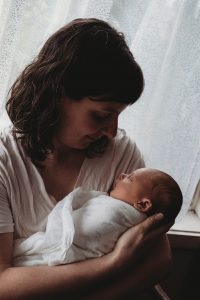 Moonlight Baby Sleep Consultant Melbourne - mother holding swaddled baby